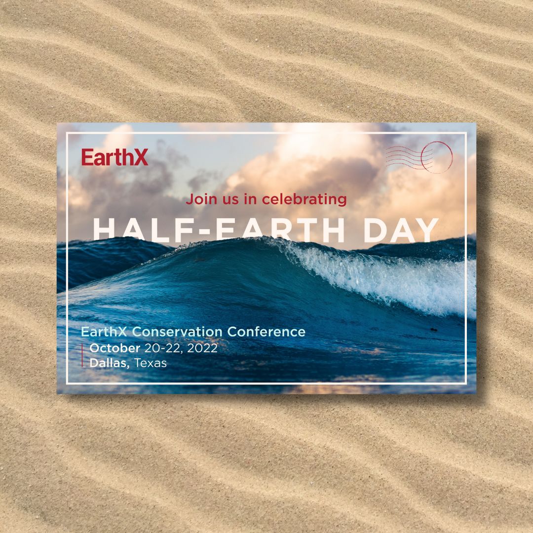 EarthX mockup of a direct mail piece that features ocean waves, lying flat on background of sand.