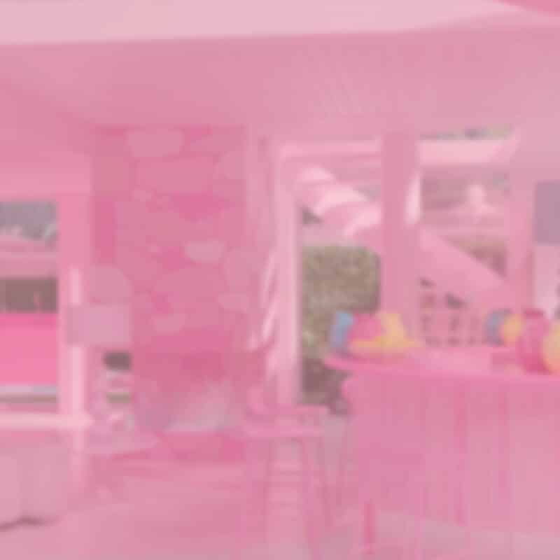 Photo of Barbie Dream House with pink gradient overlay